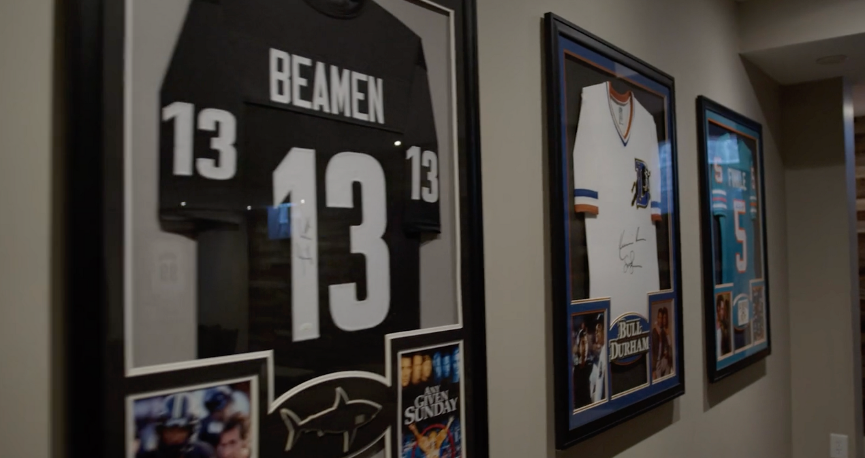 framed jerseys on wall