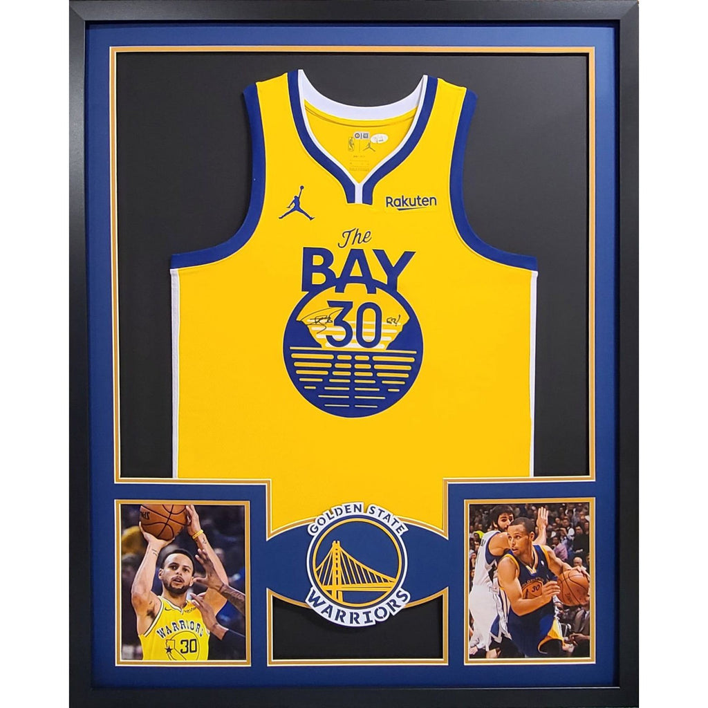 STEPHEN CURRY GOLDEN STATE WARRIORS AUTOGRAPHED JERSEY FRAMED IN SUEDE. COA
